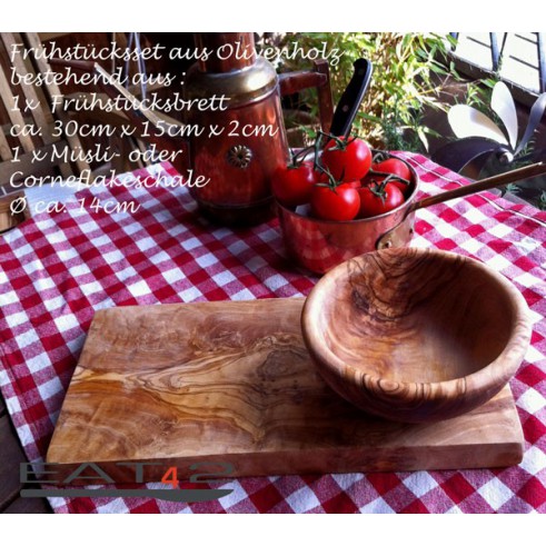 Set out of a cutting board and bowl fro breakfast